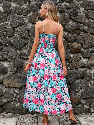 Maxi dress with floral print, smocked bodice, spaghetti straps, and flowing skirt.