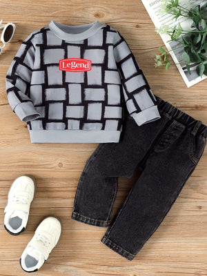 Children's grey long sleeve top with block pattern and red Legend graphic, paired with black jeans.