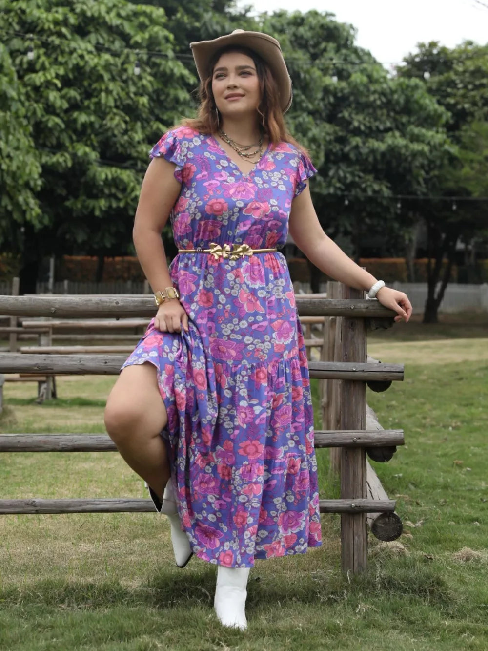 Vibrant floral tiered maxi dress with cap sleeves and cinched waist.