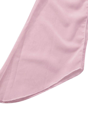 Pink chiffon mini dress detail showing draped fabric and hem.