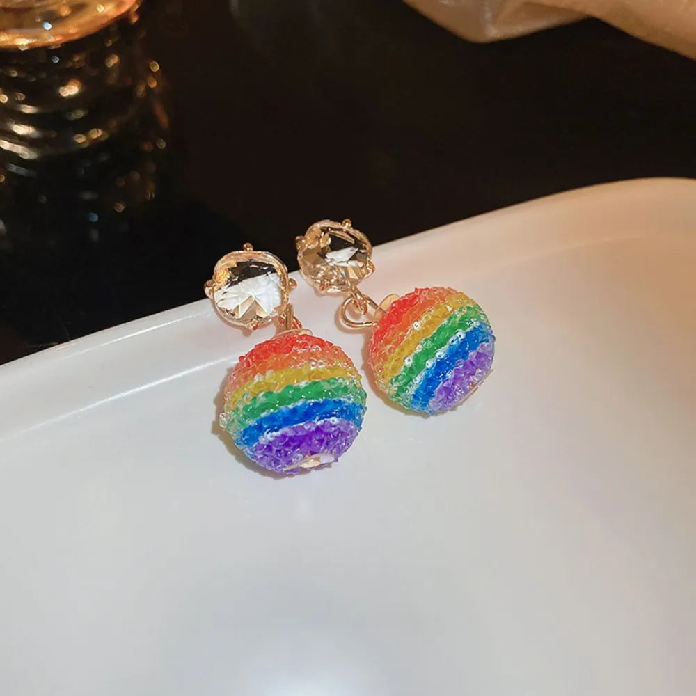 Rainbow orb crystal drop earrings with gold alloy posts and clear faceted gems.
