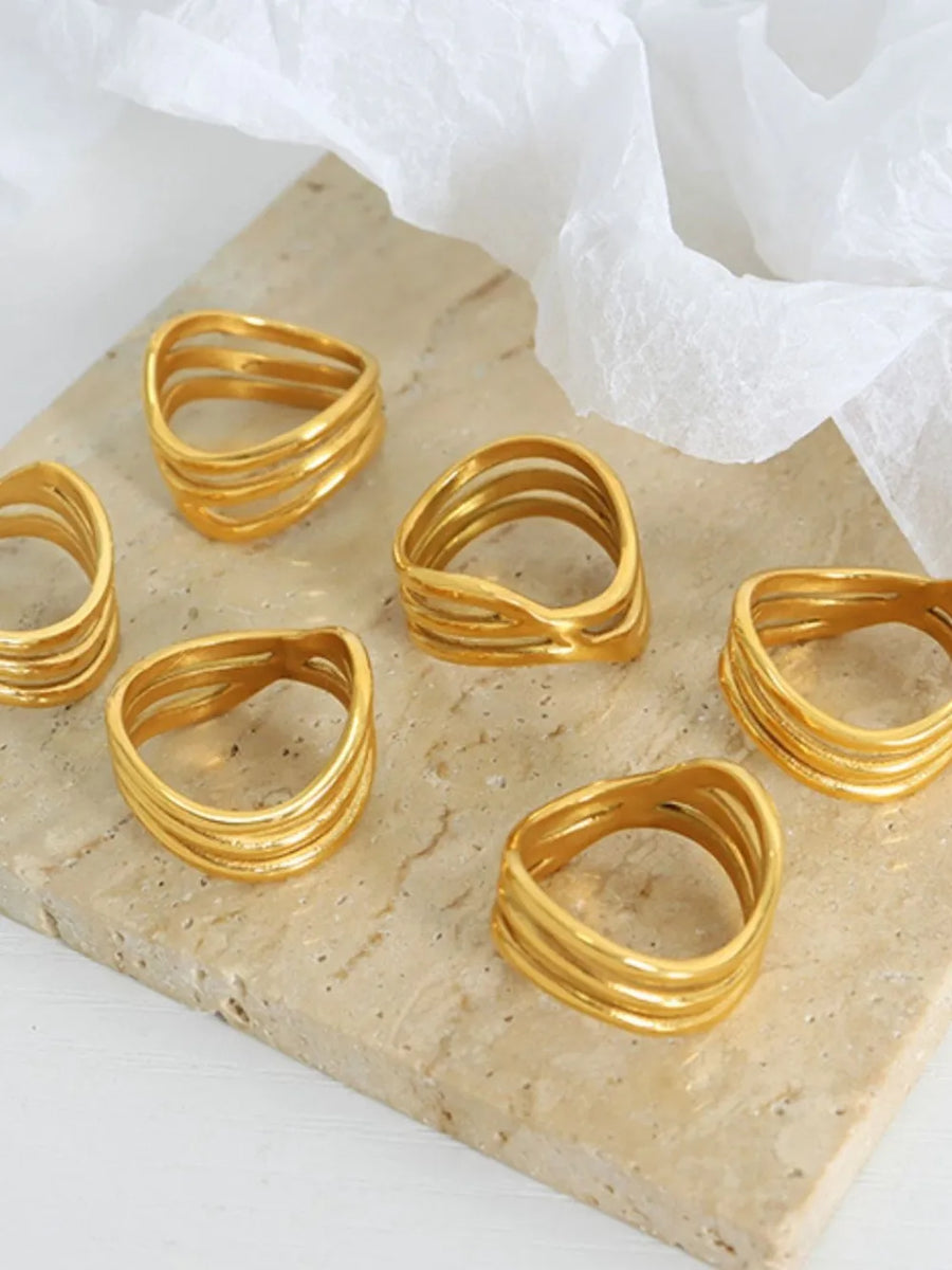 Gold triple-band sculptural ring with wavy design, 18K gold-plated