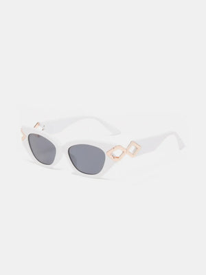 White cat-eye sunglasses with geometric gold accents and grey lenses