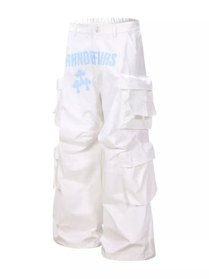 White cargo pants with blue graphic design and multiple pockets