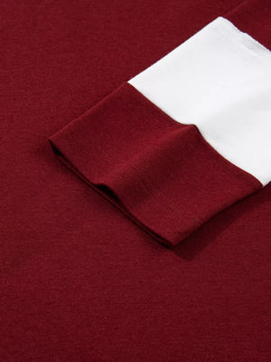 Burgundy long sleeve top with white contrasting cuff detail