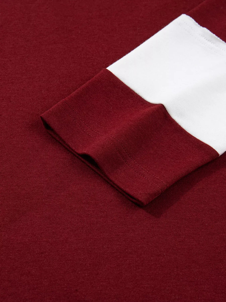 Burgundy long sleeve top with white contrasting cuff detail
