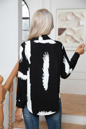 Black and white brushstroke print silk-blend button-down blouse with a collared neckline and long sleeves.