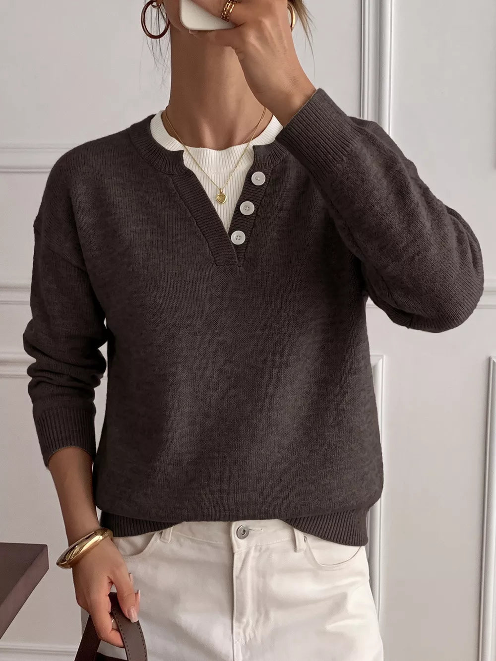 pullover sweater in dark brown featuring decorative buttons and relaxed fit