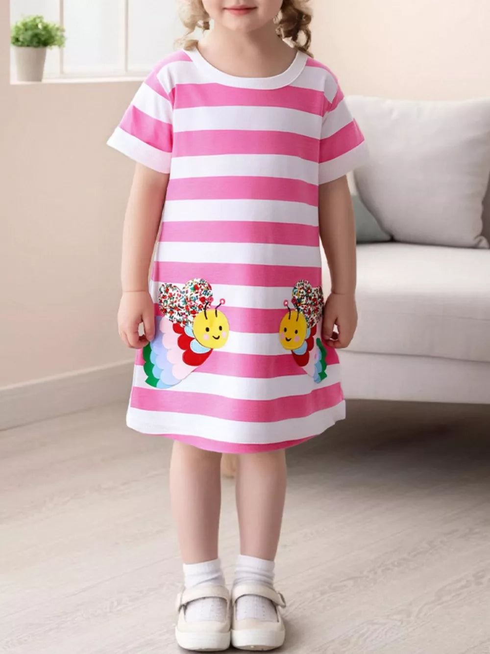 Toddler pink and white striped cotton dress with bee appliqué details.
