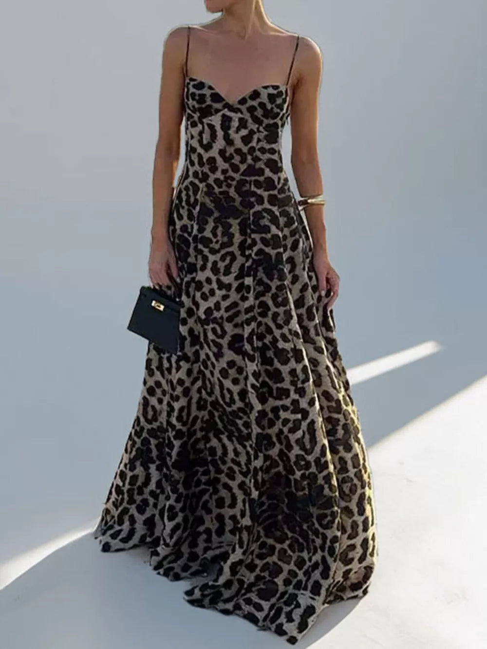 Leopard print maxi swim dress with sweetheart neckline and spaghetti straps.