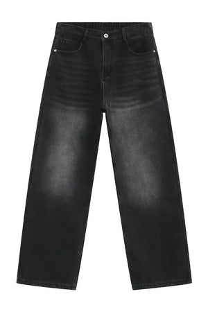 Oversized dark wash denim trousers with a faded effect and wide leg
