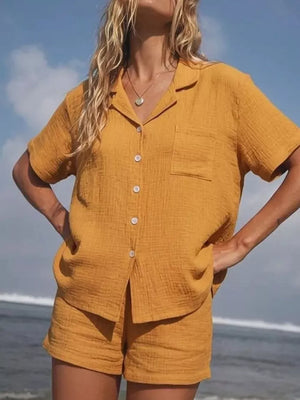 Yellow cotton button-up pajama set with collared shirt and shorts.