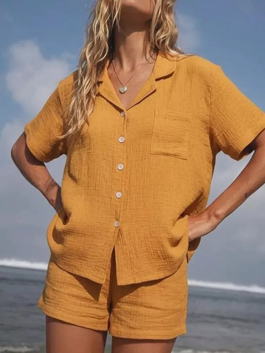 Yellow cotton button-up pajama set with collared shirt and shorts.