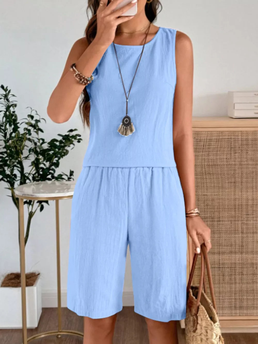 Sky blue relaxed fit tank and shorts set with round neckline and elastic waist shorts.