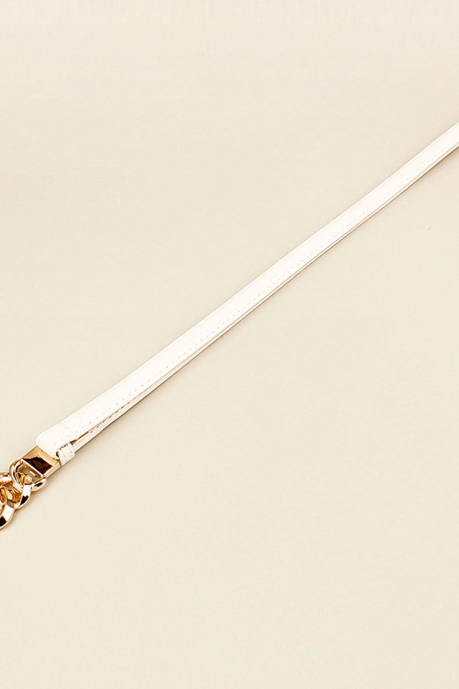 White leather belt with gold chain link buckle detail