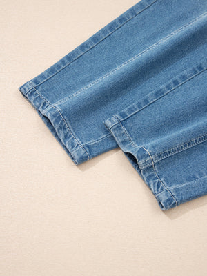 Blue denim barrel jeans with cuffed hems and visible stitching details.