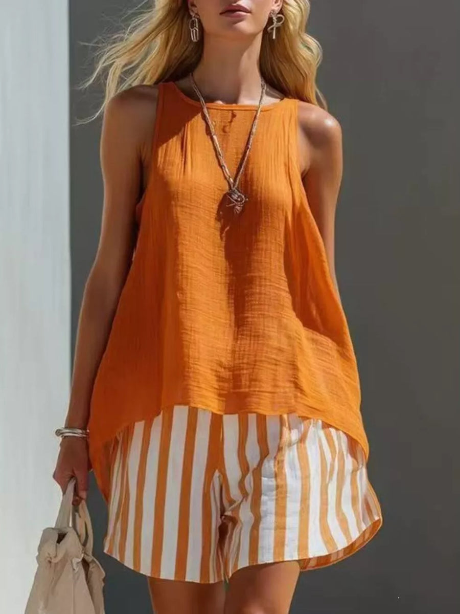 Orange sleeveless tunic over white and orange striped shorts