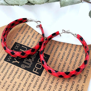 Red buffalo check statement hoop earrings with silver hardware.