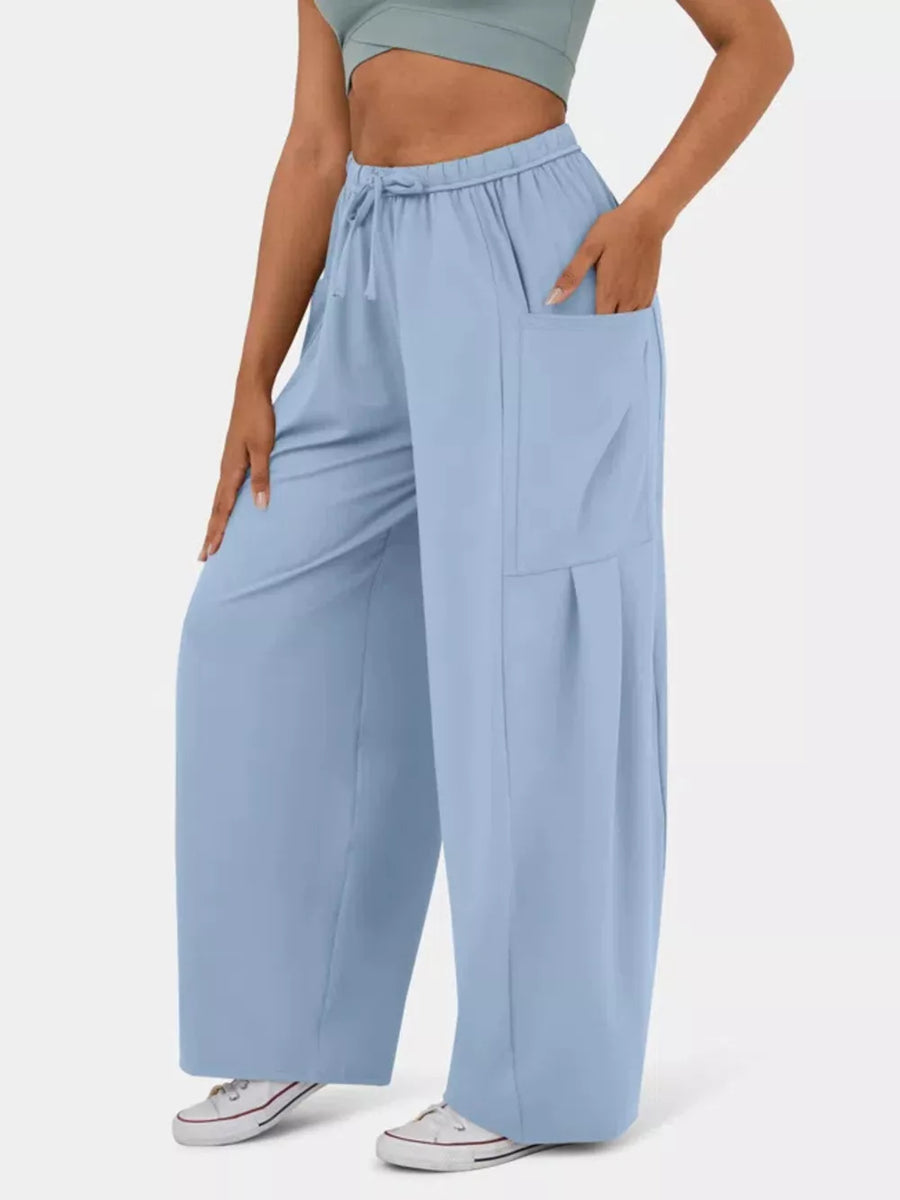 Light blue maternity pants with wide legs, drawstring waist, and cargo pockets.