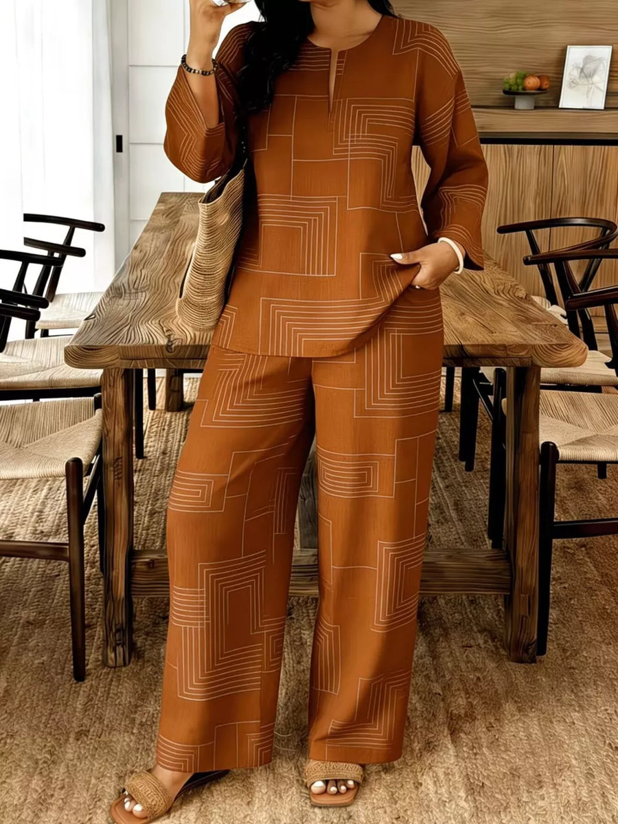 Brown geometric print wide-leg pants and matching long-sleeve top with split neckline.