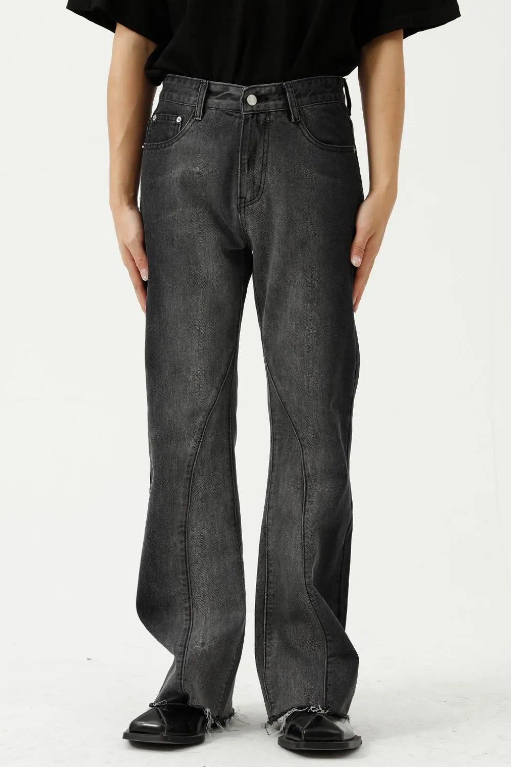 Dark wash cotton flare jeans with seam detail and raw hem