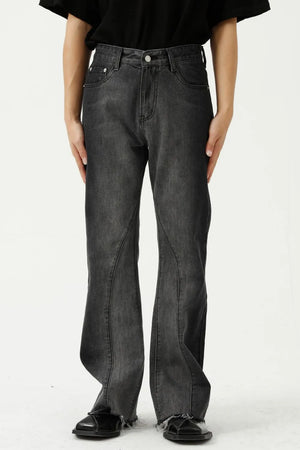 Dark wash cotton flare jeans with seam detail and raw hem