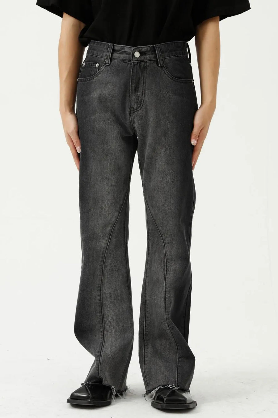 Dark wash cotton flare jeans with seam detail and raw hem