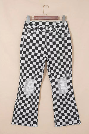 Checkerboard distressed cropped jeans with raw hem and ripped knees.
