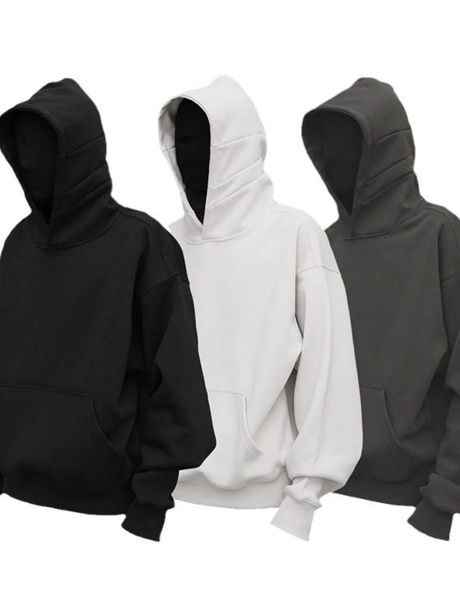 Oversized slouch hoodies in black, light gray, and dark gray with kangaroo pockets.