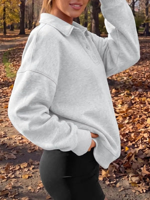 Black sweatshirt with hip-length and half-button