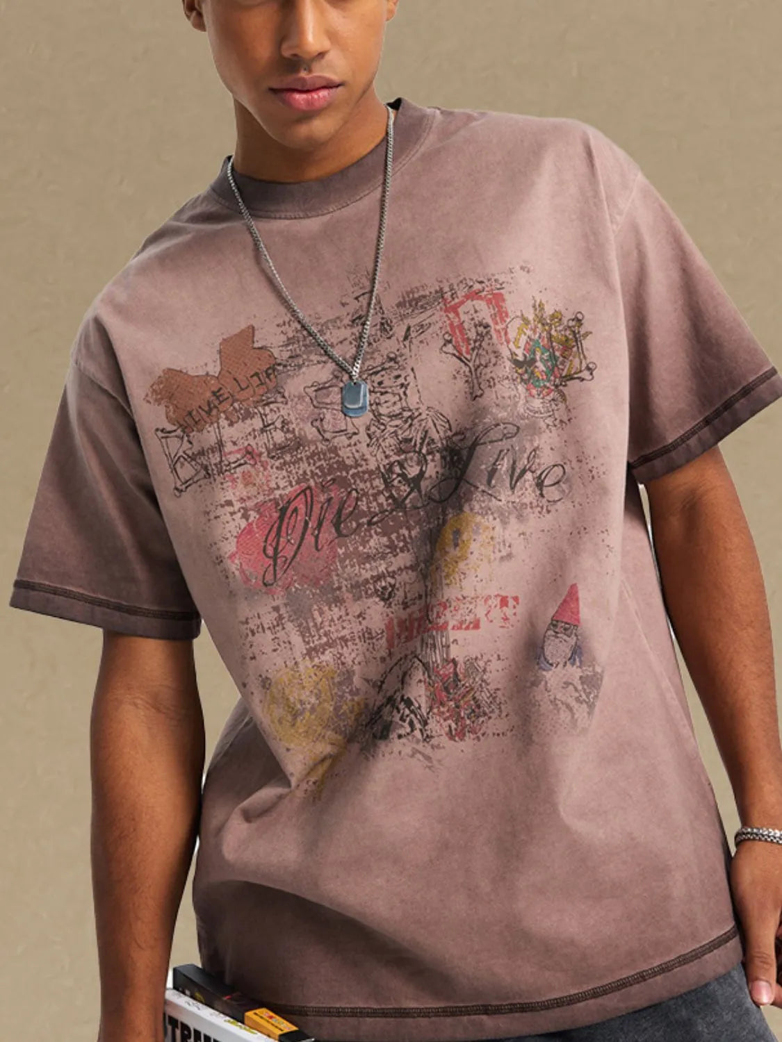 Mocha vintage wash graphic tee with distressed graffiti print and crew neck.