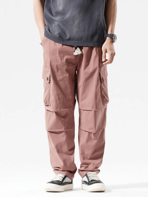 Men's loose fit cargo sweatpants in coral red with drawstring and multiple pockets.