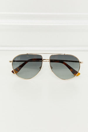 Gradient lens aviator sunglasses with gold frames and tortoise shell accents.