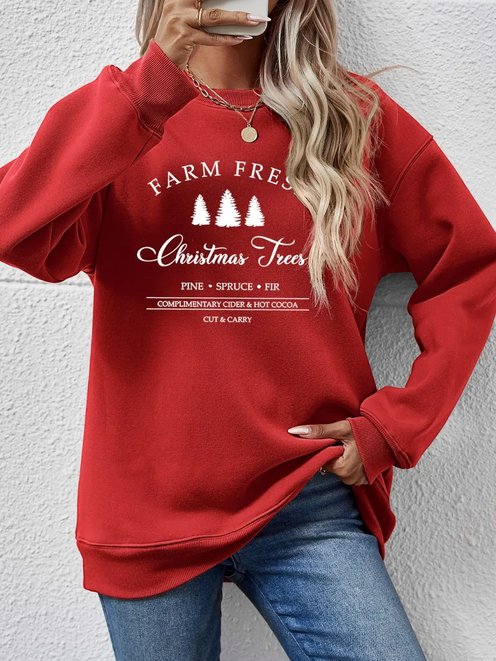 Red graphic sweatshirt with "Farm Fresh Christmas Trees" print.