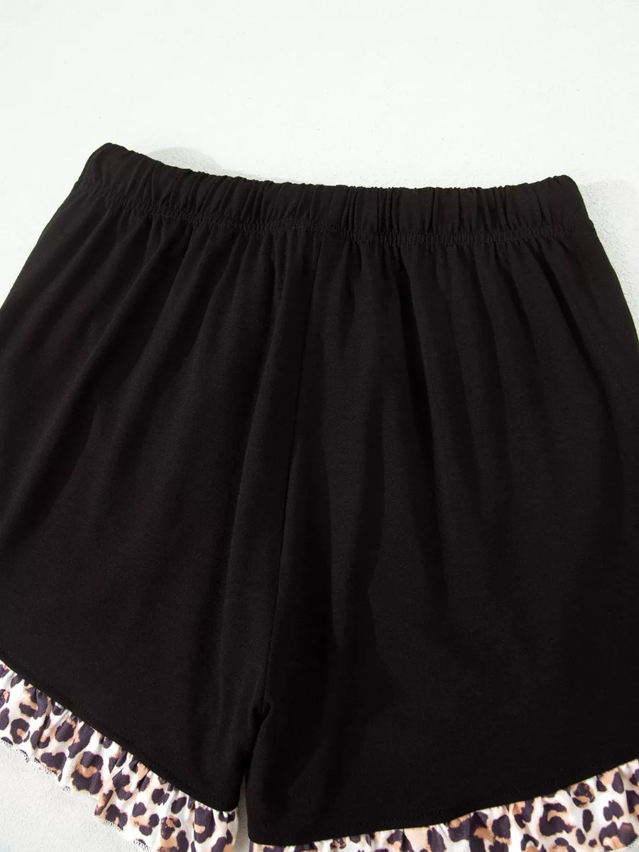 Black pajama shorts with elastic waist and leopard print ruffle trim