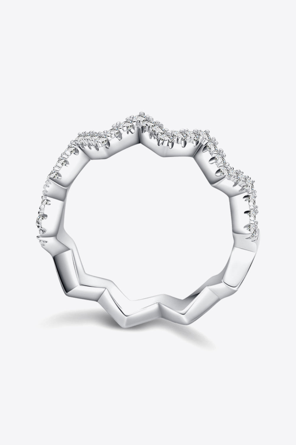 Silver zigzag pavé moissanite band ring with a geometric design.