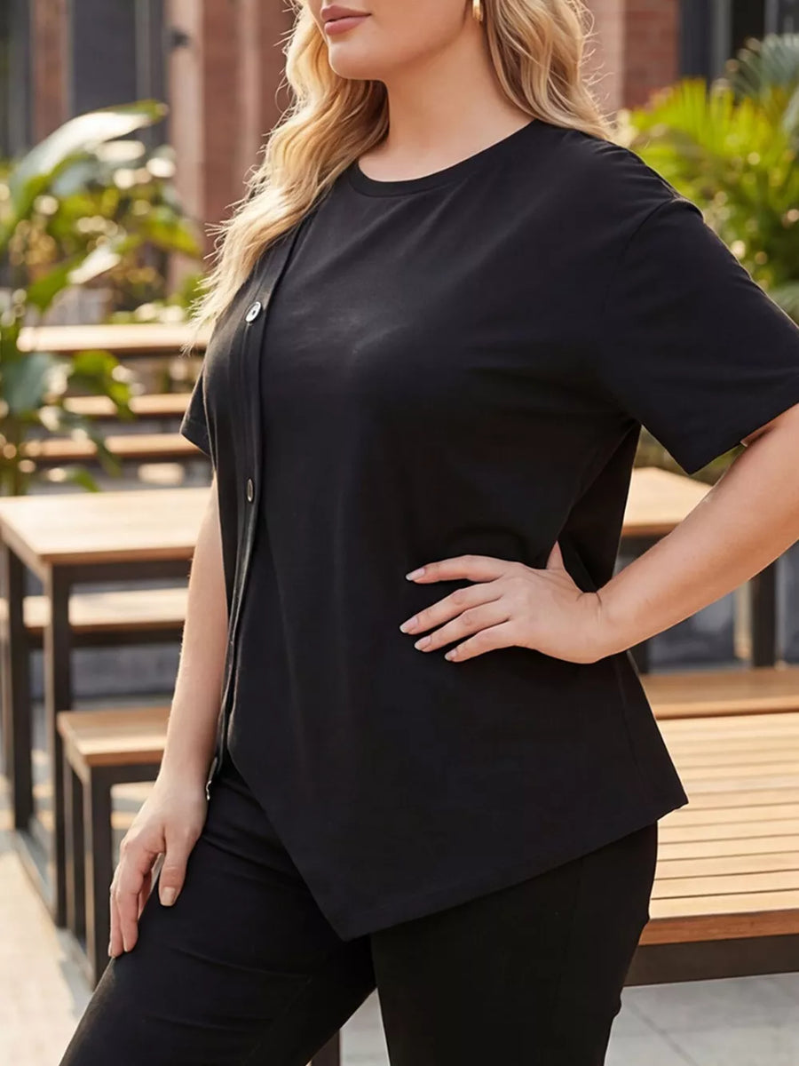 Black asymmetrical plus-size t-shirt with button accent and short sleeves.