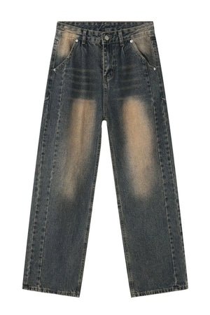 Baggy dark wash denim jeans with faded detailing and a relaxed fit.