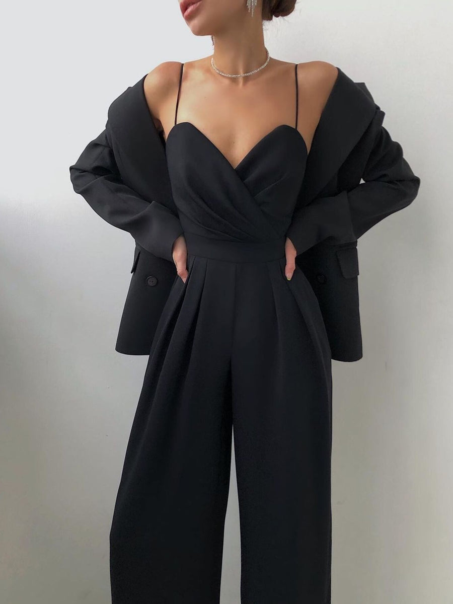 Black ruched spaghetti strap wide-leg jumpsuit with sweetheart neckline and pleated pants.