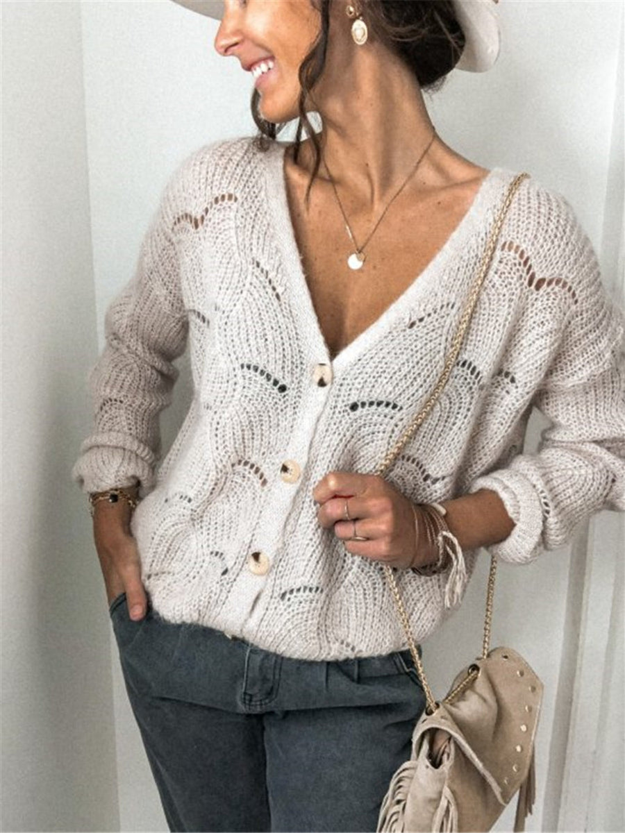 Beige scalloped knit button-down cardigan with openwork details and wooden buttons.