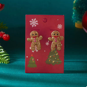 Mustard earrings featuring rhinestone embellishment and novelty