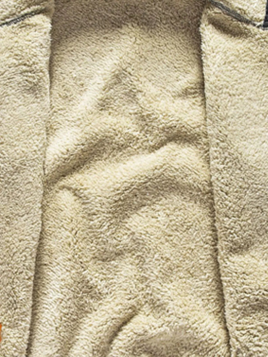 Men's black zip-up hoodie with plush fleece lining detail