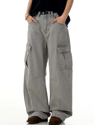 Men's grey vintage wide-leg cargo pants with multiple pockets and a relaxed fit.
