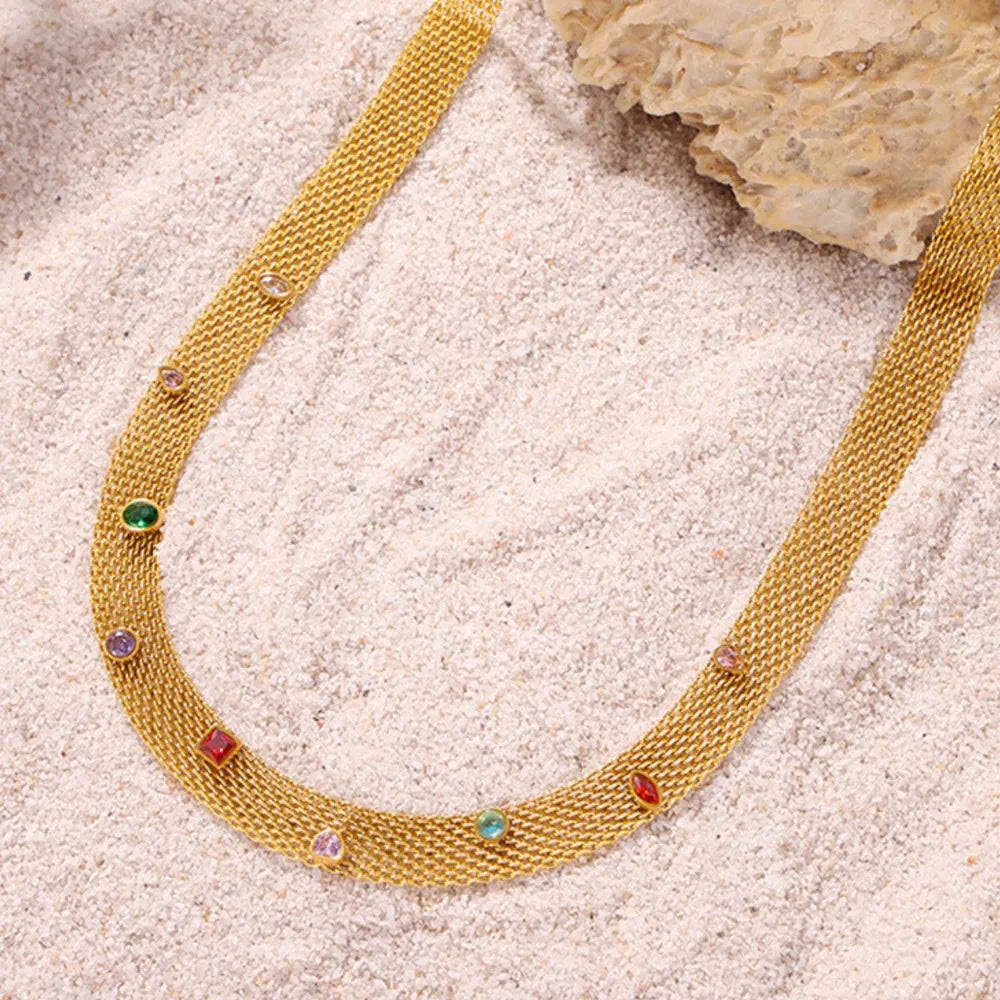 Gold mesh collar necklace with colorful gemstone embellishments