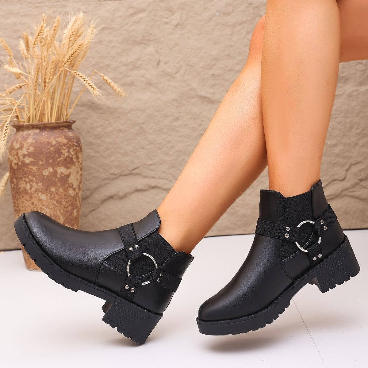 boots in black featuring block heel and ankle boot fit