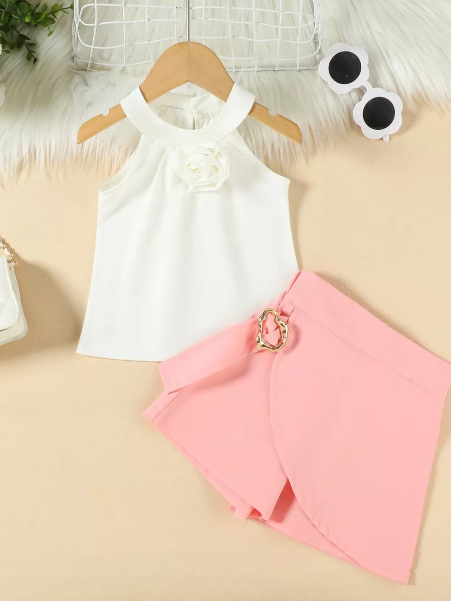 White halter top with floral applique and pink skort with gold heart buckle.