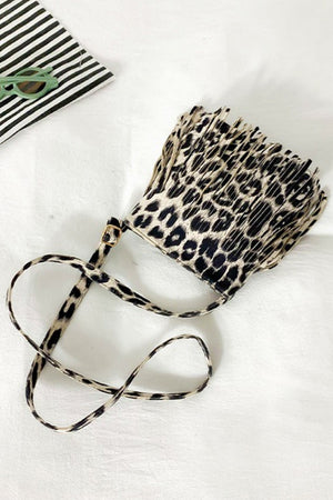 Leopard print crossbody bag with fringe detail and adjustable strap
