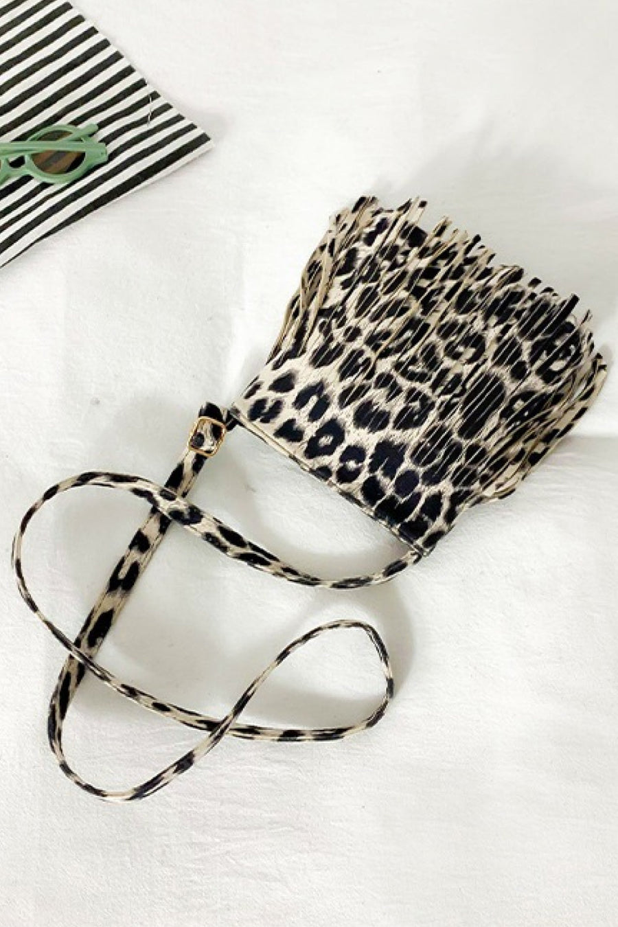 Leopard print crossbody bag with fringe detail and adjustable strap