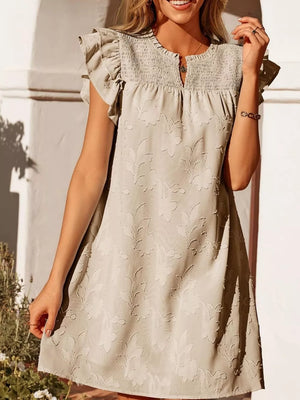 Apricot floral embossed mini dress with smocked bodice and ruffled sleeves