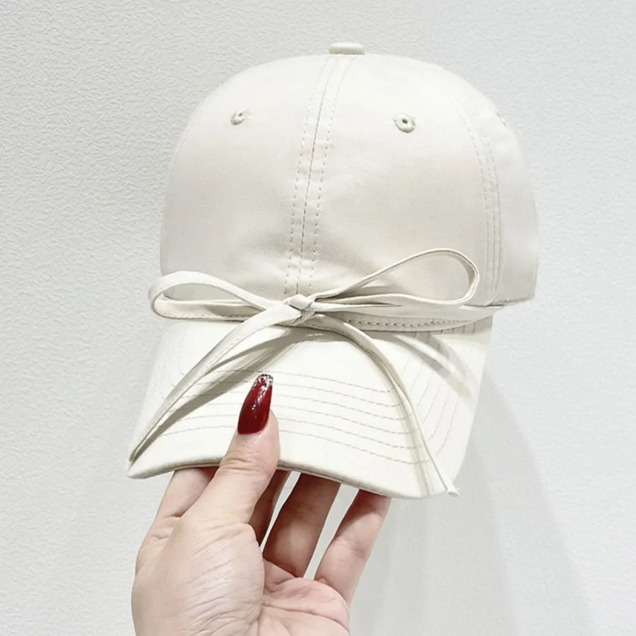 Cream baseball cap with bow detail